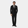 Black Roma Suit - This breezy black Roma suit features a relaxed fit and subtly curved notch lapel, giving it a touch of nonchalant refinement and understated detail. Paired here with regular fit high-waisted trousers.